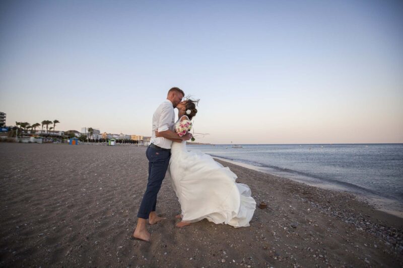 Wedding photography in Rhodes.Couple kissing at the beach